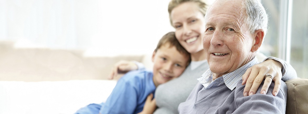 Elderly man sitting with daughter and grandson