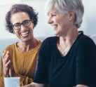 Two women laughing together