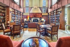 Library with shelves of books on the walls and tables in the middle of the room