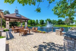 Patio furniture next to pond with fountain