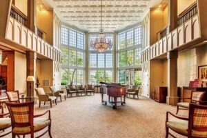 Piano room with chairs surrounding Grand piano